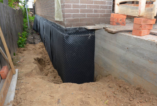 Happy homeowners after waterproofing job in Dickerson
